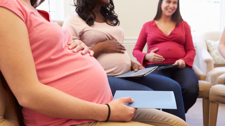 Pregnant women in waiting room. 